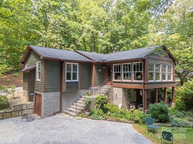 85 Red Bird Rd, Tryon, NC 28782 - view of front of property featuring stairs, roof with shingles, a sunroom, and a chimney