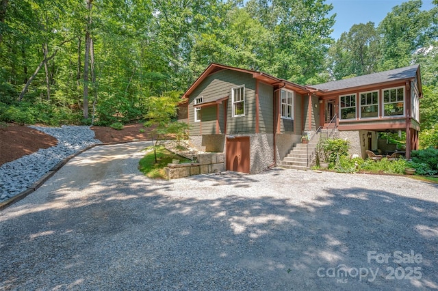 85 Red Bird Rd, Tryon, NC 28782 - view of front of property featuring gravel driveway and stairway