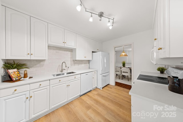 8806 Golf Ridge Dr, Charlotte, NC 28277 - kitchen with white appliances, white cabinetry, decorative backsplash, and light countertops