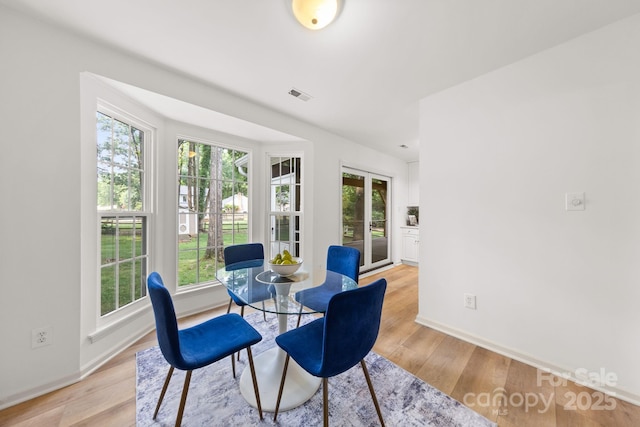 8806 Golf Ridge Dr, Charlotte, NC 28277 - dining room with baseboards and light wood finished floors