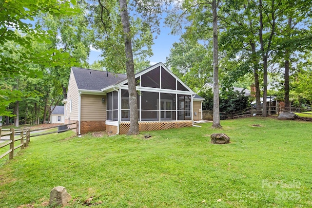 8806 Golf Ridge Dr, Charlotte, NC 28277 - back of house featuring a fire pit, a sunroom, a fenced backyard, and brick siding