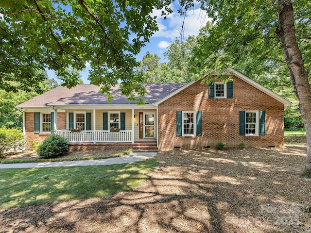 4601 Bournewood Ln, Charlotte, NC 28226 - view of front of house featuring a porch, crawl space, brick siding, and roof with shingles