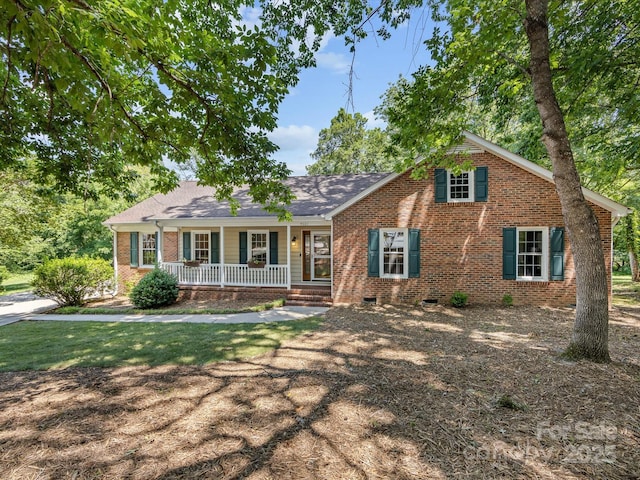 4601 Bournewood Ln, Charlotte, NC 28226 - view of front of home with a porch, brick siding, crawl space, and roof with shingles