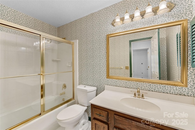 4601 Bournewood Ln, Charlotte, NC 28226 - bathroom featuring vanity, combined bath / shower with glass door, wallpapered walls, and a textured ceiling