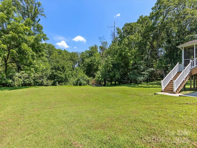 4601 Bournewood Ln, Charlotte, NC 28226 - view of grassy yard featuring stairs and a sunroom