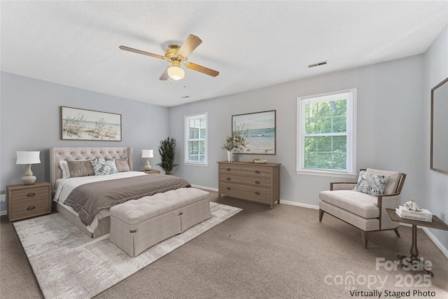 4601 Bournewood Ln, Charlotte, NC 28226 - bedroom with multiple windows, carpet floors, and ceiling fan