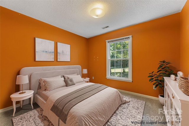 4601 Bournewood Ln, Charlotte, NC 28226 - carpeted bedroom with a textured ceiling and baseboards