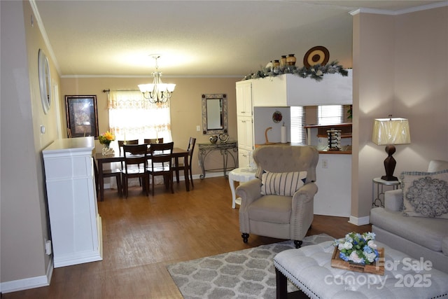 225 Emmett St, Rock Hill, SC 29730 - living room with a chandelier, healthy amount of natural light, wood finished floors, and ornamental molding