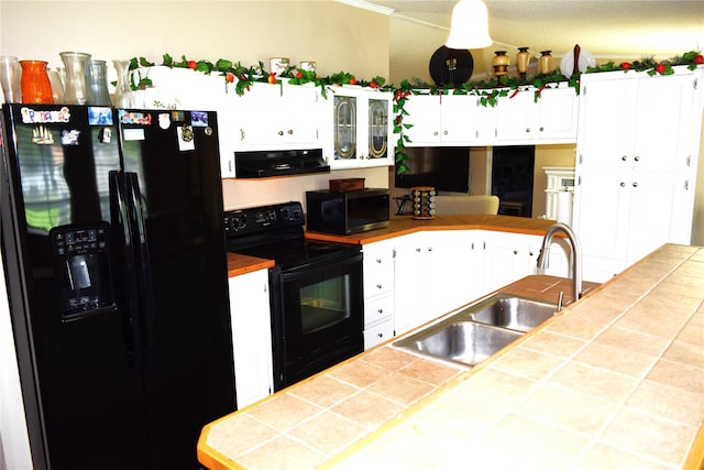 225 Emmett St, Rock Hill, SC 29730 - kitchen with black appliances, extractor fan, white cabinetry, and tile countertops