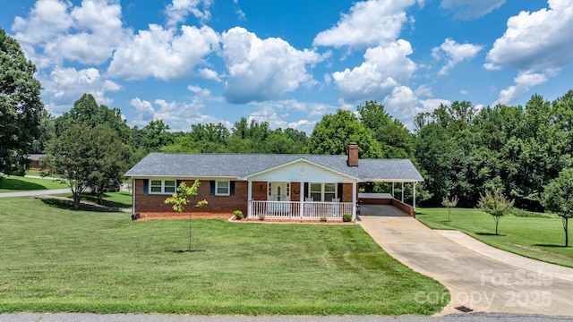 100 Pinecrest Ct, Taylorsville, NC 28681 - view of front facade with covered porch, a carport, concrete driveway, a front lawn, and brick siding