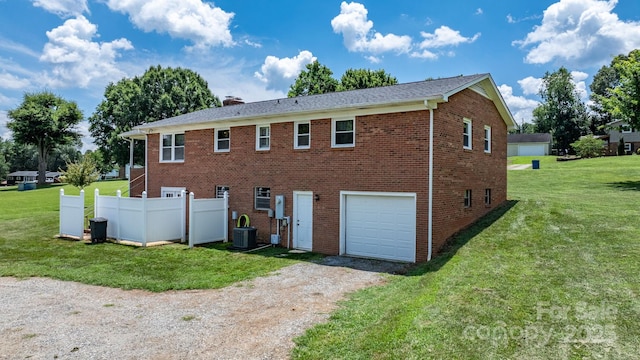 100 Pinecrest Ct, Taylorsville, NC 28681 - rear view of house featuring an attached garage, driveway, brick siding, and a chimney