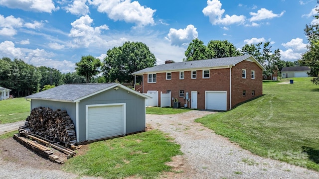 100 Pinecrest Ct, Taylorsville, NC 28681 - view of front facade featuring driveway, brick siding, a chimney, a front yard, and an outdoor structure