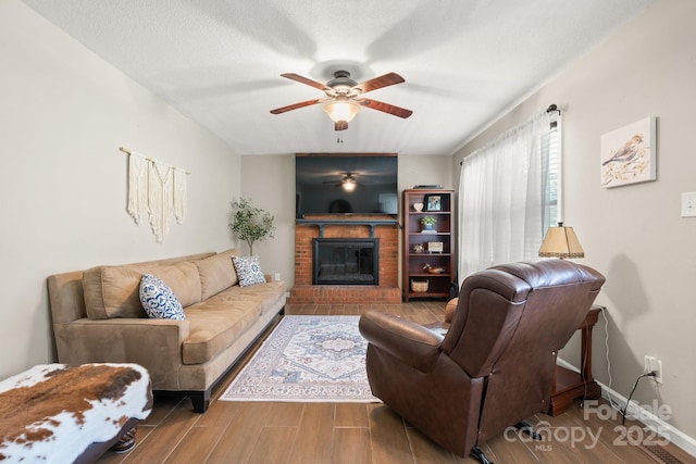 100 Pinecrest Ct, Taylorsville, NC 28681 - living area featuring ceiling fan, wood finished floors, and a fireplace