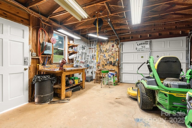 100 Pinecrest Ct, Taylorsville, NC 28681 - garage featuring a workshop area
