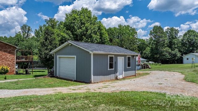 100 Pinecrest Ct, Taylorsville, NC 28681 - detached garage with driveway and a trampoline