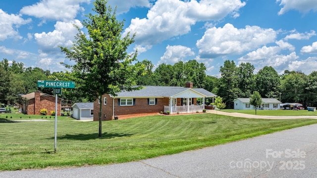 100 Pinecrest Ct, Taylorsville, NC 28681 - ranch-style house featuring a porch, a front yard, driveway, and brick siding