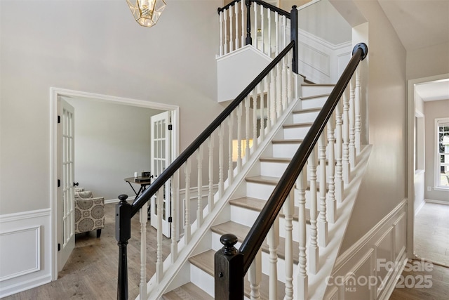 7930 Lancken Dr, Charlotte, NC 28277 - stairway featuring wood finished floors and a wainscoted wall