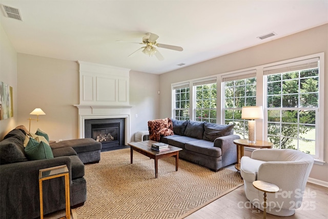7930 Lancken Dr, Charlotte, NC 28277 - living area featuring a ceiling fan, light wood-style flooring, and a large fireplace