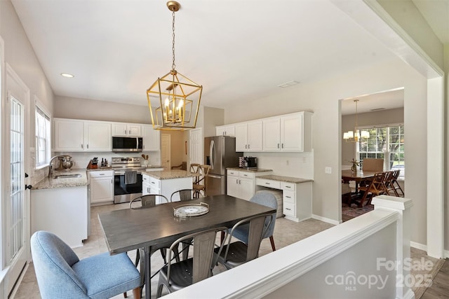 7930 Lancken Dr, Charlotte, NC 28277 - dining area featuring a chandelier and recessed lighting