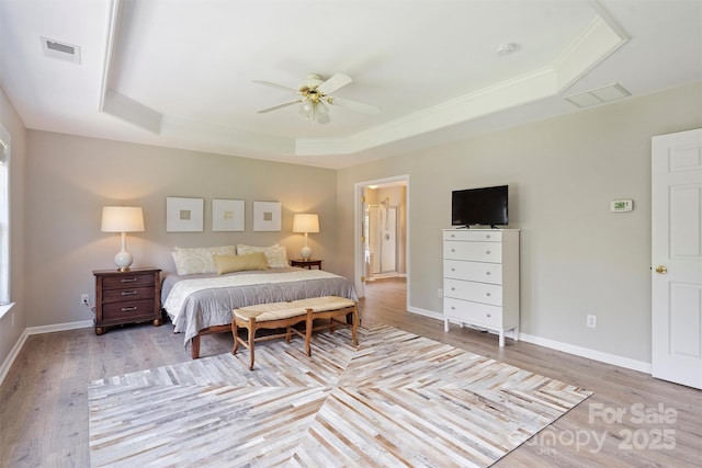 7930 Lancken Dr, Charlotte, NC 28277 - bedroom featuring a tray ceiling, light wood-style flooring, and ceiling fan