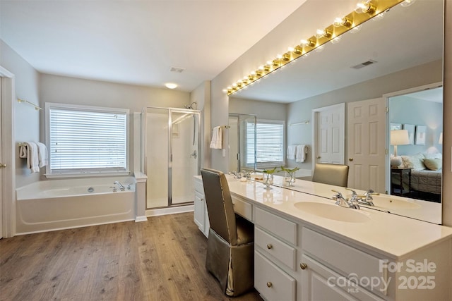 7930 Lancken Dr, Charlotte, NC 28277 - bathroom with double vanity, wood finished floors, a garden tub, and a shower stall
