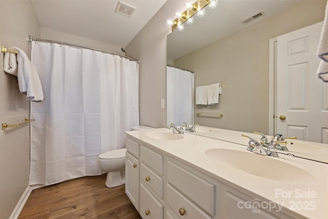 7930 Lancken Dr, Charlotte, NC 28277 - bathroom with wood finished floors, double vanity, and a shower with shower curtain