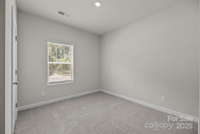 4502 Bright Rd, Charlotte, NC 28214 - spare room featuring light carpet and recessed lighting