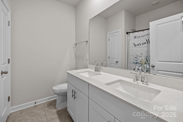 4502 Bright Rd, Charlotte, NC 28214 - full bathroom featuring double vanity, tile patterned flooring, and a shower with shower curtain