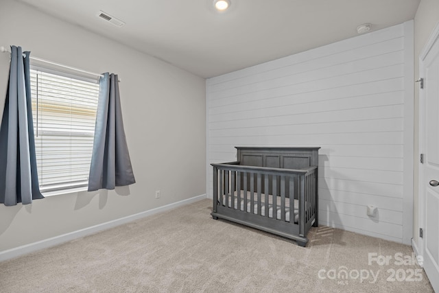 4502 Bright Rd, Charlotte, NC 28214 - unfurnished bedroom with carpet and a crib