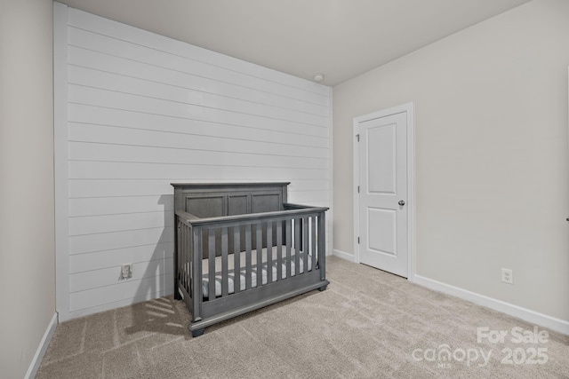 4502 Bright Rd, Charlotte, NC 28214 - unfurnished bedroom featuring carpet and a nursery area