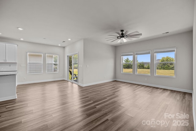 4502 Bright Rd, Charlotte, NC 28214 - unfurnished living room with dark wood-style flooring, recessed lighting, and ceiling fan