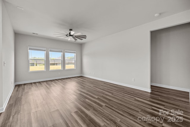 4502 Bright Rd, Charlotte, NC 28214 - unfurnished room with a smoke detector, ceiling fan, and dark wood finished floors