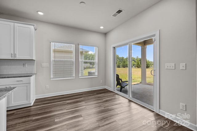 4502 Bright Rd, Charlotte, NC 28214 - unfurnished dining area featuring dark wood-type flooring and recessed lighting