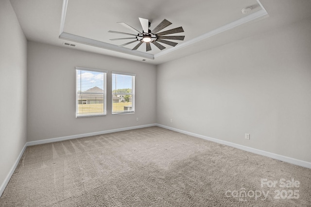 4502 Bright Rd, Charlotte, NC 28214 - unfurnished room featuring a tray ceiling, ceiling fan, carpet flooring, a smoke detector, and ornamental molding