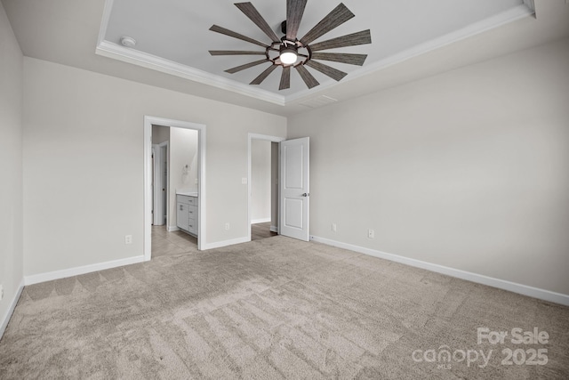 4502 Bright Rd, Charlotte, NC 28214 - unfurnished bedroom with a raised ceiling, light carpet, ornamental molding, and ensuite bathroom