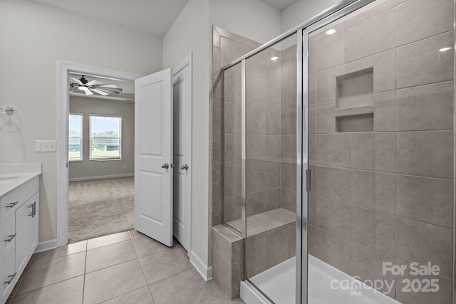 4502 Bright Rd, Charlotte, NC 28214 - bathroom with vanity, a ceiling fan, a shower stall, and tile patterned floors
