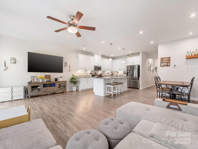 510 Park Meadows Dr, Matthews, NC 28104 - living room with a ceiling fan, recessed lighting, and light wood-type flooring