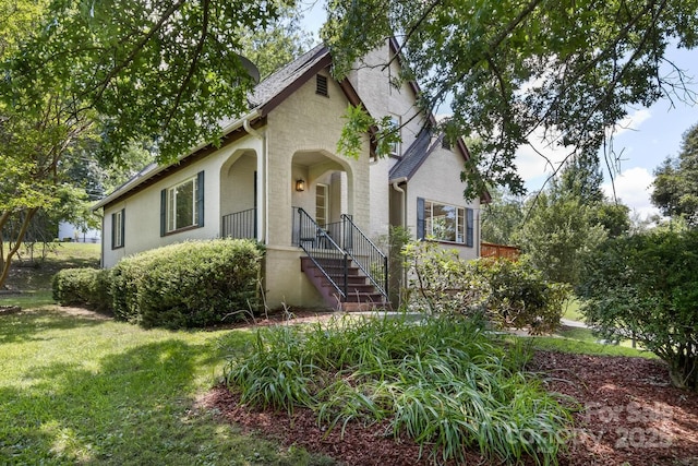 39 Nix Rd, Hendersonville, NC 28792 - view of front of home featuring a front yard, a chimney, and brick siding