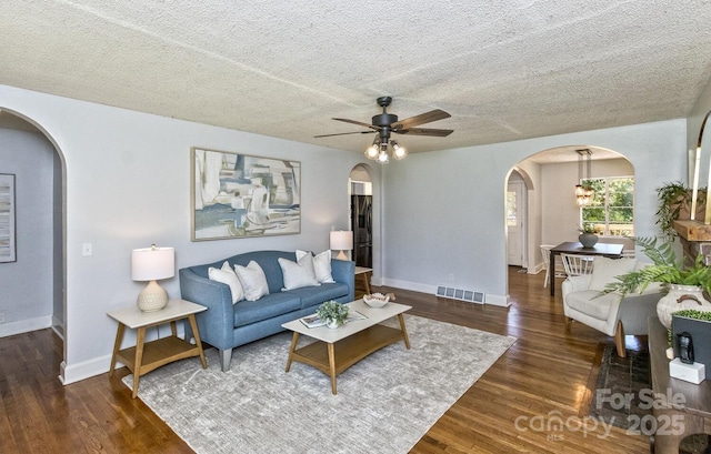 39 Nix Rd, Hendersonville, NC 28792 - living room with arched walkways, a ceiling fan, wood finished floors, and a textured ceiling