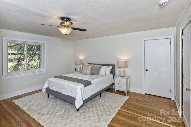 39 Nix Rd, Hendersonville, NC 28792 - bedroom with wood finished floors, ceiling fan, and a textured ceiling