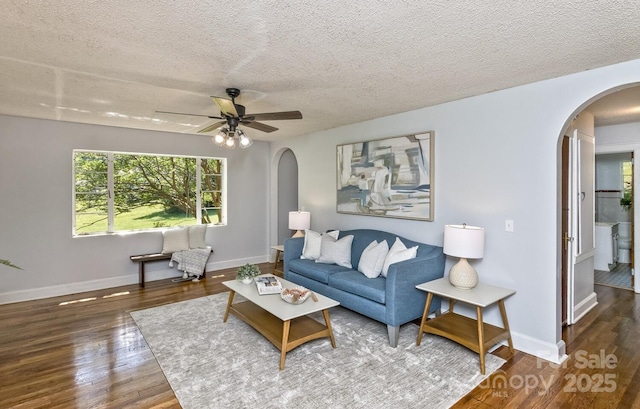 39 Nix Rd, Hendersonville, NC 28792 - living area with arched walkways, wood finished floors, ceiling fan, and a textured ceiling