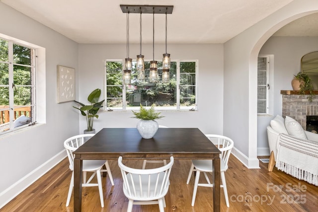39 Nix Rd, Hendersonville, NC 28792 - dining area featuring arched walkways, wood finished floors, and plenty of natural light