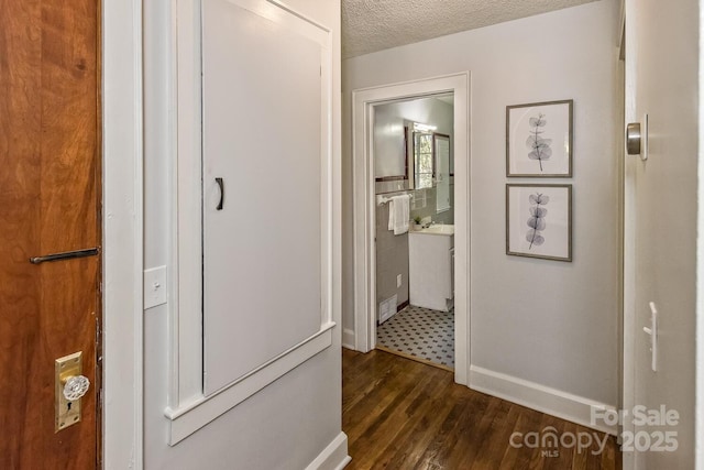 39 Nix Rd, Hendersonville, NC 28792 - hall with dark wood finished floors and a textured ceiling