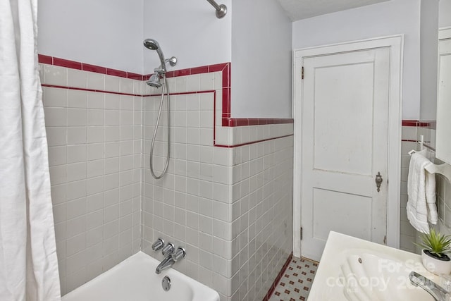 39 Nix Rd, Hendersonville, NC 28792 - bathroom with a wainscoted wall, shower / tub combo, and tile walls