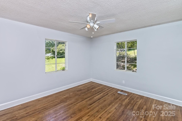 39 Nix Rd, Hendersonville, NC 28792 - unfurnished room featuring wood-type flooring, healthy amount of natural light, a ceiling fan, and a textured ceiling