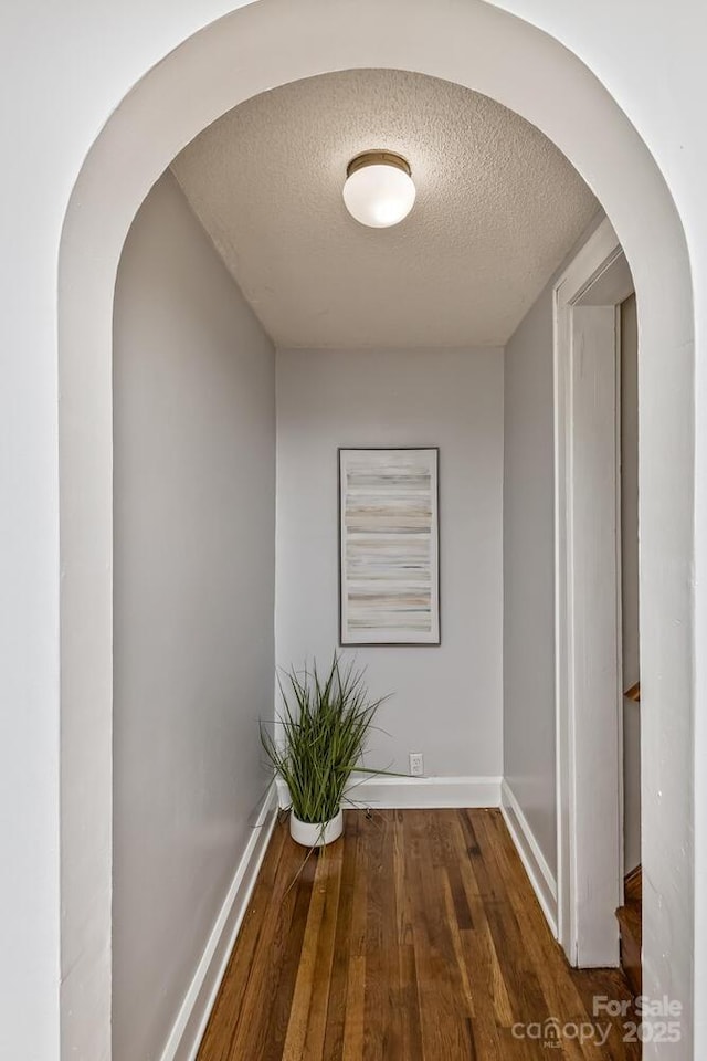 39 Nix Rd, Hendersonville, NC 28792 - corridor featuring a textured ceiling, arched walkways, and wood finished floors