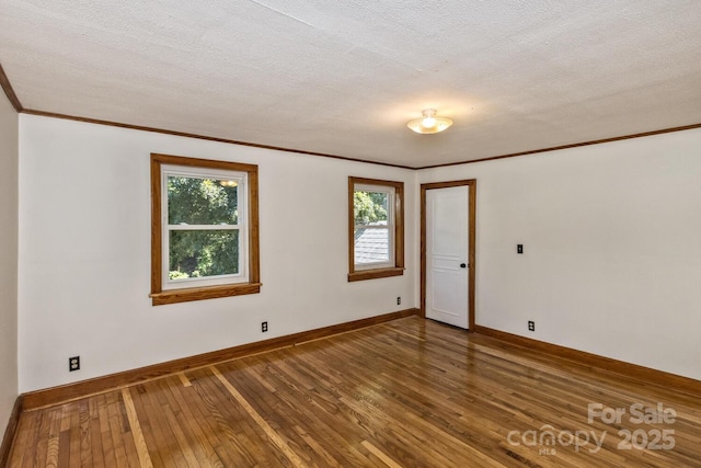 39 Nix Rd, Hendersonville, NC 28792 - spare room featuring hardwood / wood-style floors, ornamental molding, and a textured ceiling