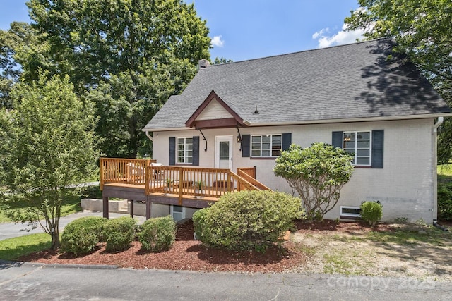 39 Nix Rd, Hendersonville, NC 28792 - view of front of property featuring a wooden deck, a shingled roof, and brick siding
