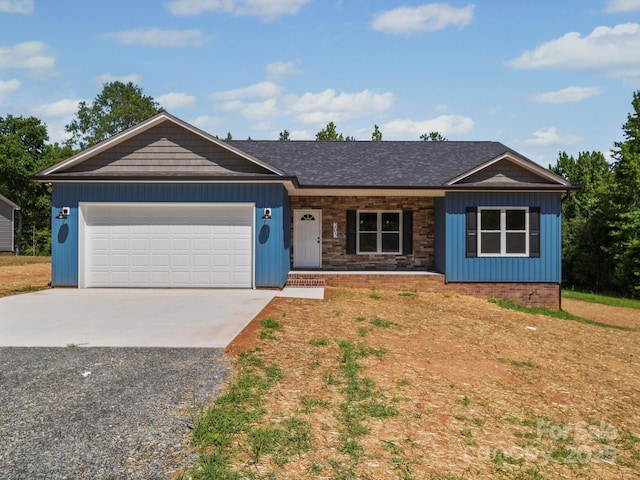 205 S Hill Ave, Albemarle, NC 28001 - ranch-style home featuring concrete driveway, an attached garage, covered porch, and board and batten siding