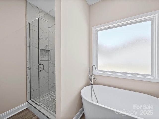 205 S Hill Ave, Albemarle, NC 28001 - full bath with a freestanding tub, a marble finish shower, and wood finished floors